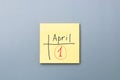 April fools day reminder on yellow sticky note in form of calendar. be aware and do not let be fooled