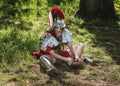 Roman centurion put on his sandals during the Elf Fantasy Fair