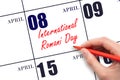 April 8. Hand writing text International Romani Day on calendar date. Save the date.