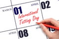 April 1. Hand writing text International Tatting Day on calendar date. Save the date.