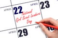 April 22. Hand writing text National Girl Scout Leaders Day on calendar date. Save the date. Royalty Free Stock Photo