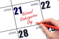 April 21. Hand writing text National Kindergarten Day on calendar date. Save the date.