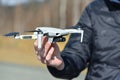 10 April 2022 - Krakow, Poland: Pilot holds the Drone DJI Mavic Mini 2 before flight. Quadcopter is ready to fly