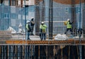 April, 15 2020, in Madrid, Spain a group of workers working in construction with masks during the covid-19 pandemic