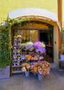 April 2022 Modena, Italy: Florist`s shop with flowers bouquets in baskets and buckets close-up.
