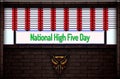 April month special day. National High Five Day, Neon Text Effect on Bricks Background