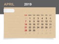 April 2019 - Monthly calendar on brown paper and wood background with area for note.