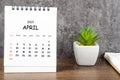 The April 2023 Monthly desk calendar for 2023 with diary on wooden table Royalty Free Stock Photo