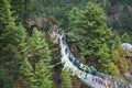 8 April 2018 - Nepal ::trekker cross the river by suspension bridge Royalty Free Stock Photo