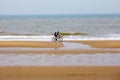 North Sea Hague Scheveningen Netherlands dutch sun Den Haag ride bicycle bicyclist shore reflection morning men Royalty Free Stock Photo