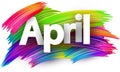 April paper word sign with colorful spectrum paint brush strokes over white