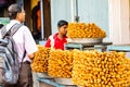 April 2019, Puri, Orissa, India. Tourists buying Khaja Snacks,Layered Fritters Dunked In Sugar Syrup, for sale in sweet shop