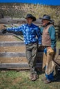 APRIL 22, 2017, RIDGWAY COLORADO: Father Vince Kotny & son during cattle branding exchange words, at Centennial Ranch, Ridgway, Co