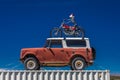 April 27, 2017 Roadside attraction of skeleton driving a motorcycle ontop of a old car along State. Motorcycle, skull and bones Royalty Free Stock Photo