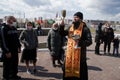 April 19, 2020, Russia, Magnitogorsk. Church Easter ceremony of consecration during the coronavirus pandemic. A priest sprinkles Royalty Free Stock Photo