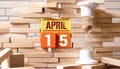 April 15, Save the date with number cube design for background