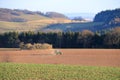 April 7 2018 - Saxony, Germany: a Tractor working on the farm, a modern agricultural transport, a farmer working in the field, Royalty Free Stock Photo