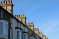 14 April 2023 - Suffolk, UK: English street with blue sky above old chimneys Royalty Free Stock Photo