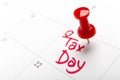 April tax day written and pinned in a calender, close up Royalty Free Stock Photo