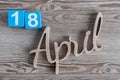 April 18th. Day 18 of april month, color calendar on wooden background. Spring time