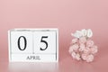 April 05th. Day 5 of month. Calendar cube on modern pink background, concept of bussines and an importent event