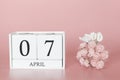 April 07th. Day 7 of month. Calendar cube on modern pink background, concept of bussines and an importent event