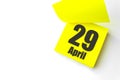 April 29th. Day 29 of month, Calendar date. Close-Up Blank Yellow paper reminder sticky note on White Background. Spring month, Royalty Free Stock Photo