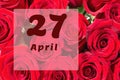 April 27th. Day of 27 month, calendar date. Natural background of red roses. A bouquet of dark red roses