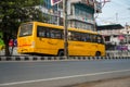 April 13th 2022, Dehradun City Uttarakhand India. A big yellow DIT University bus carrying student on the streets of dehradun city