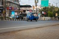 April 13th 2022, Dehradun City Uttarakhand India. Traditional blue three wheeler auto rickshaw carrying goods on the streets