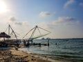 April 20th, 2020-Kochi, Kerala, India- Vacated and deserted chinese fishing net systems during the day in covid 19 Lockdown in Royalty Free Stock Photo