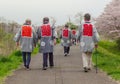 2016 April 10. Tokyo Japan. Japanese old men group wearing traditional cover and join in full blooming cherry blossom sakura festi