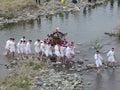 2016 April 10. Tokyo Japan. young people team from village bring the Mikoshi to passing over TAMAKAWA river in Japanese traditiona