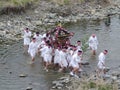 2016 April 10. Tokyo Japan. young people team from village bring the Mikoshi to passing over TAMAKAWA river in Japanese traditiona