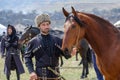 Caucasian mountaineer in national costume with his horse.