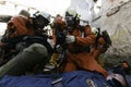 A group of rescuers provide first aid to the victim during the collapse of the building.