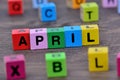 April word on table Royalty Free Stock Photo