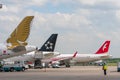 Apron of Domodedovo airport with passenger planes of various airlines. Tails of passenger commercial aircraft. Moscow