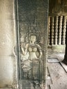Apsara dancer carved on the wall of Prasat Bayon Khmer ancient temple. Angkor Wat in Siem Reap, Cambodia. Royalty Free Stock Photo