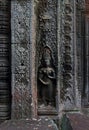 Apsara deva bas-relief on wall Ta Prohm temple