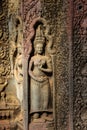 Apsaras an old Khmer art carvings on the wall in Ta Prohm Temple