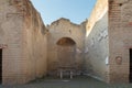 Apsidal room (Aula Absidata) in Palaestra in ancient Ercolano (Herculaneum) city ruins Royalty Free Stock Photo