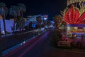 ?aptivating nocturnal scene of Las Vegas featuring mesmerizing blurred light trails left by cars on bustling Strip Road.