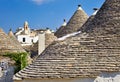 Apulia Puglia Italy. Alberobello. Trulli: traditional Apulian dry stone huts with a conical roof