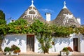 Apulia Puglia Italy. Alberobello. Trulli: traditional Apulian dry stone huts with a conical roof