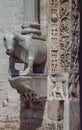 Italy. Bari. Basilica of San Nicola. Decoration of the frame of the main portal and sculpture of cow than supports a column