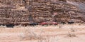 Bedouin tents stand at the foot of a cliff in the Wadi Rum desert near Aqaba city in Jordan Royalty Free Stock Photo