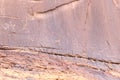 Fragment of surviving rock inscriptions left over from ancient times on a rock in the Wadi Rum desert near Aqaba city in Jordan