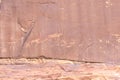 Fragment of surviving rock inscriptions left over from ancient times on a rock in the Wadi Rum desert near Aqaba city in Jordan