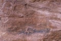 Fragment of surviving rock inscriptions left over from ancient times on a rock in the Wadi Rum desert near Aqaba city in Jordan